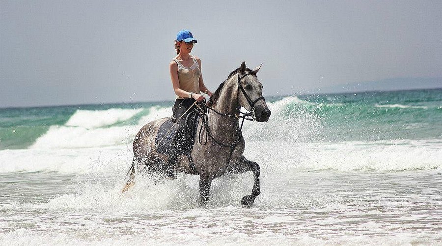 Rider splashing through ocean waves