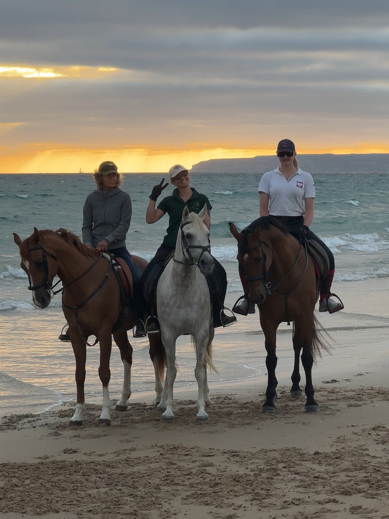 Three riders at sunset
